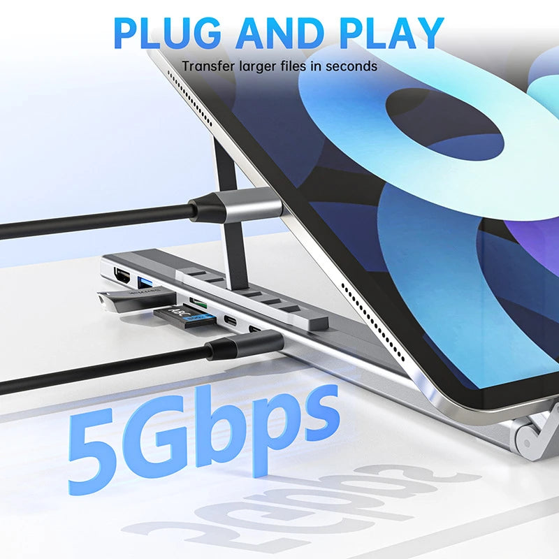 USB hub attached to a tablet with 'Plug and Play' and '5Gbps' text on a light background