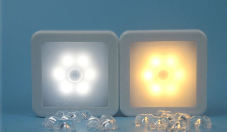 Two square light-emitting devices showing white and yellow light on a blue background.