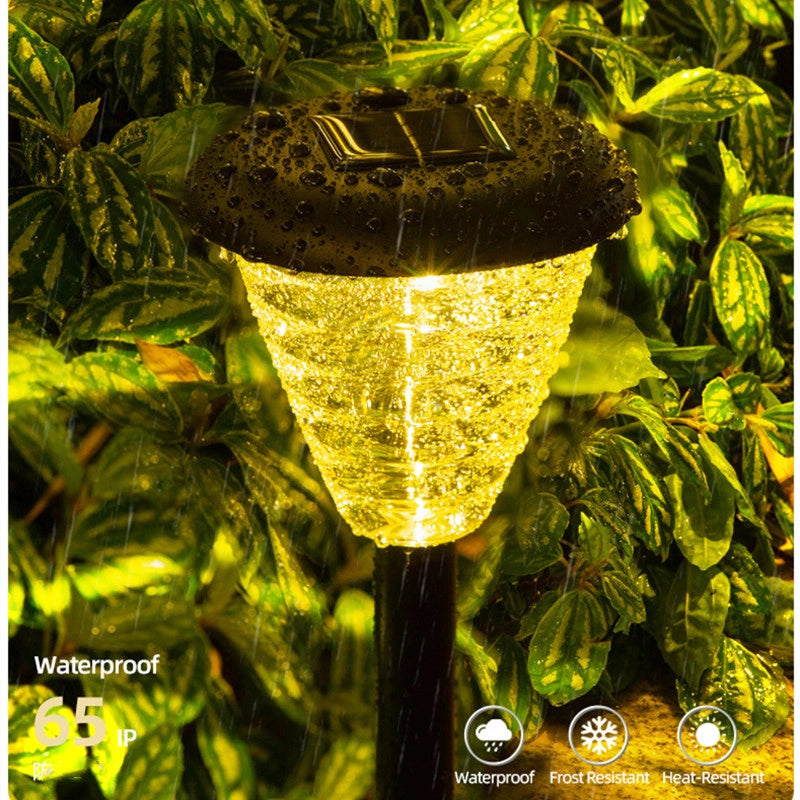 Solar garden light with waterproof label on green foliage