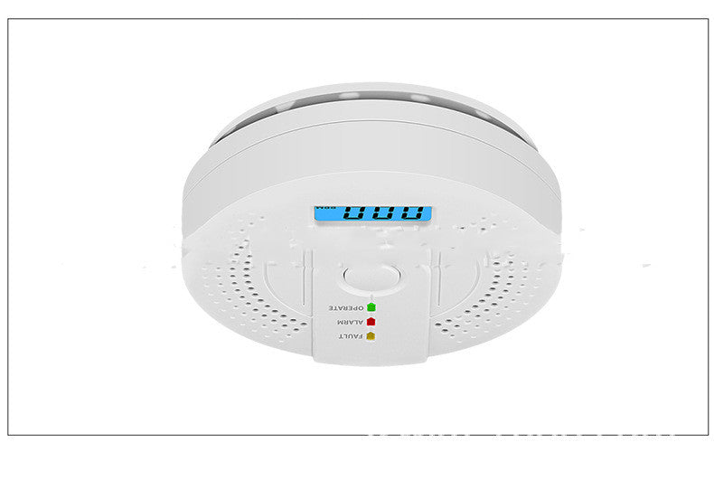 White smoke detector with digital display on a white background