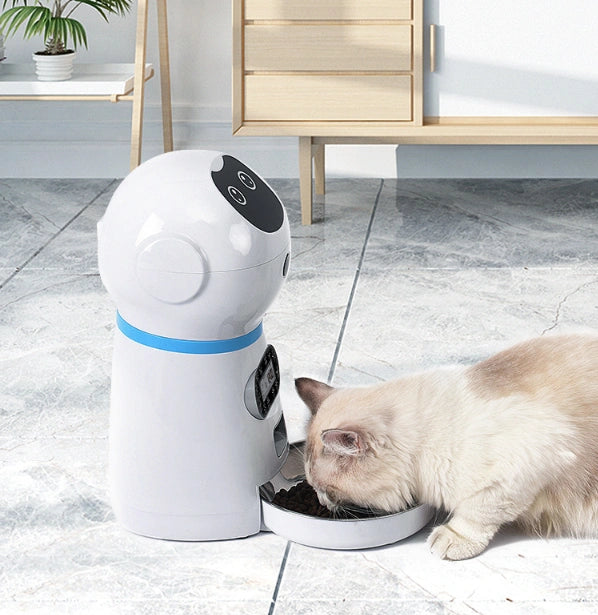 Pet water fountain with a cat drinking from it on a tiled floor.