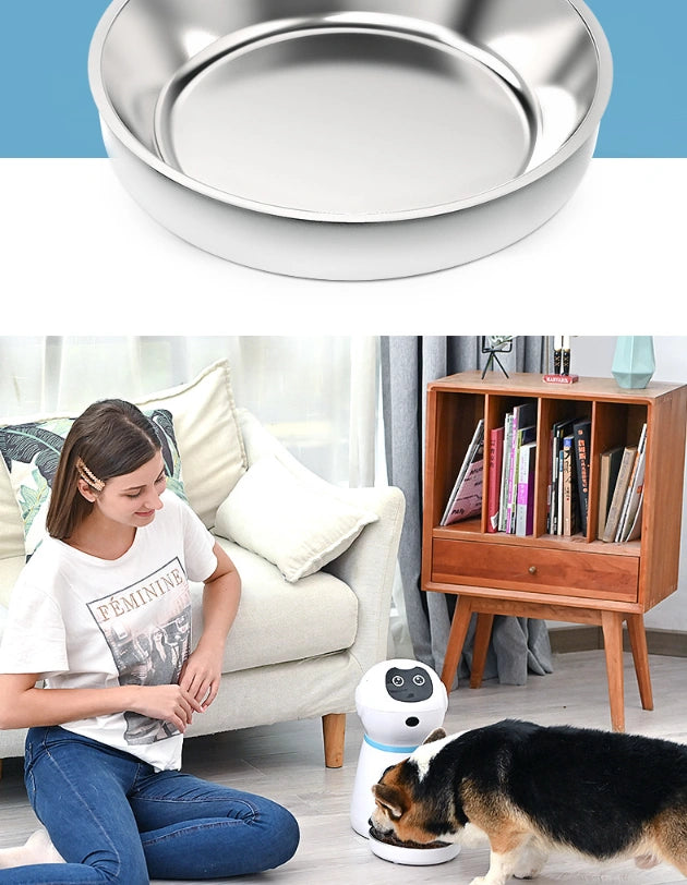 Stainless steel bowl above a woman sitting on a couch with a dog and a robot in a living room.
