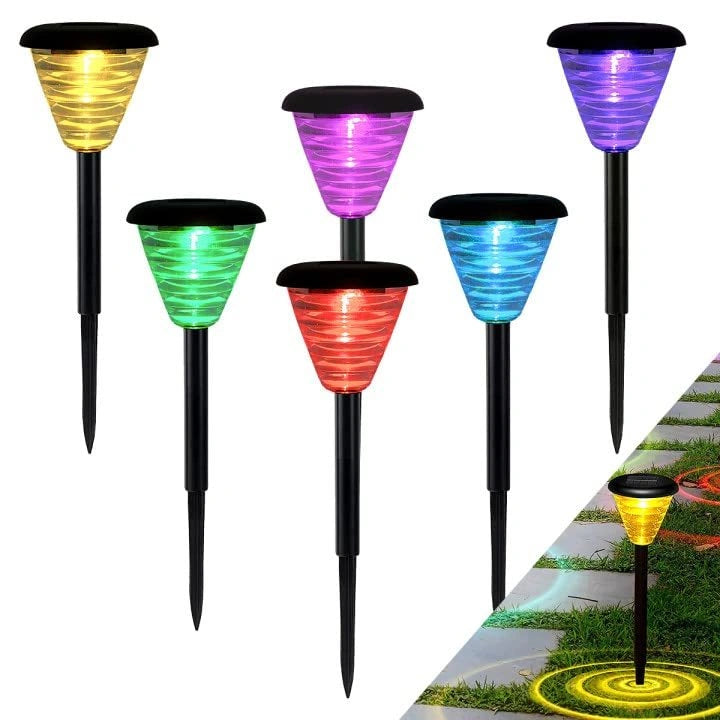 Set of colorful solar-powered garden lights on a white background