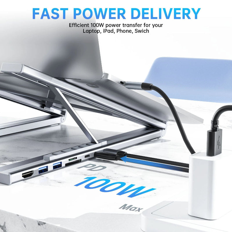 Laptop stand with multiple ports and a power adapter, emphasizing fast power delivery.