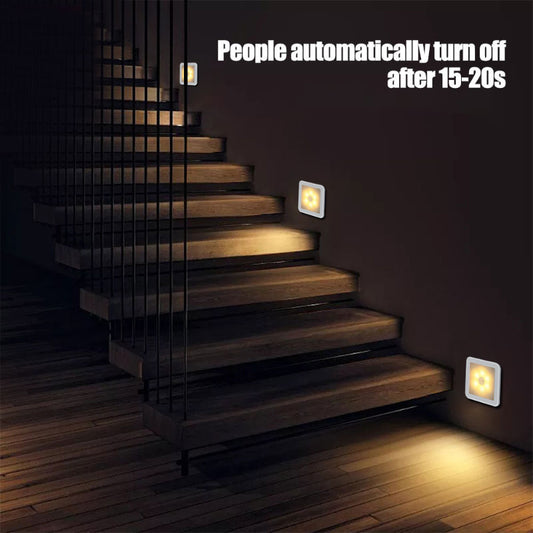 Staircase with wall-mounted lights that automatically turn off after 15-20 seconds.