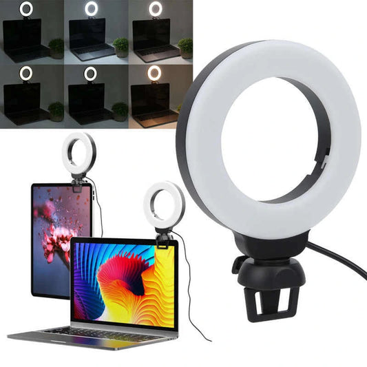 Ring light with laptop and computer monitor setup showing improved lighting.
